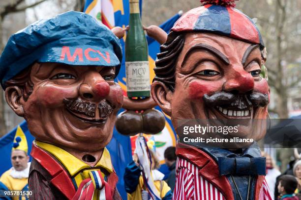 Two carnival-goers of the Mainz' Carnival Association in costume take part in the Rosenmontag carnival procession in Mainz, Germany, 12 Febraury...