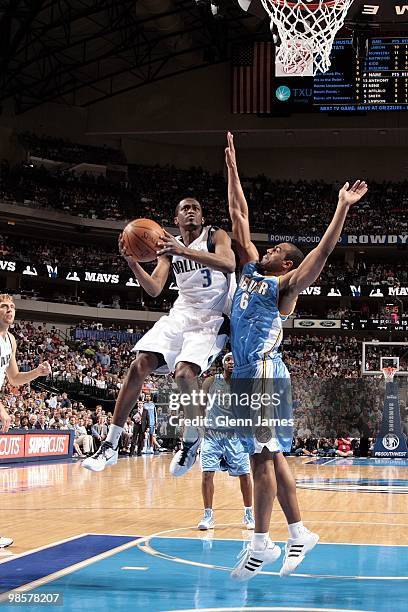 Rodrigue Beaubois of the Dallas Mavericks goes up with the ball against Arron Afflalo of the Denver Nuggets during the game at American Airlines...