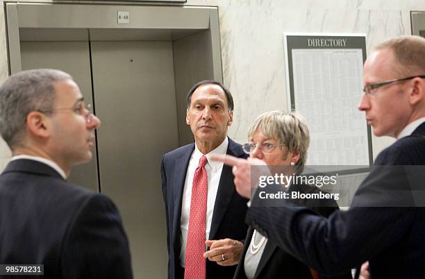 Richard Fuld, former chairman and chief executive officer with Lehman Brothers Holdings Inc., center, waits for an elevator after a House Financial...