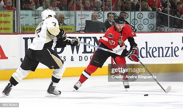 Erik Karlsson of the Ottawa Senators skates against Mark Eaton of the Pittsburgh Penguins in Game Three of the Eastern Conference Quarterfinals...