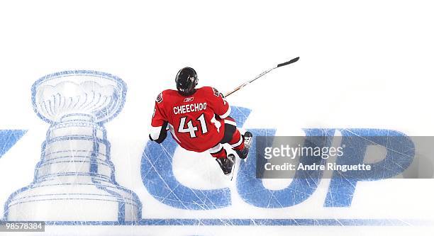 Jonathan Cheechoo of the Ottawa Senators skates over the in-ice Stanley Cup logo during warmups prior to a game against the Pittsburgh Penguins in...