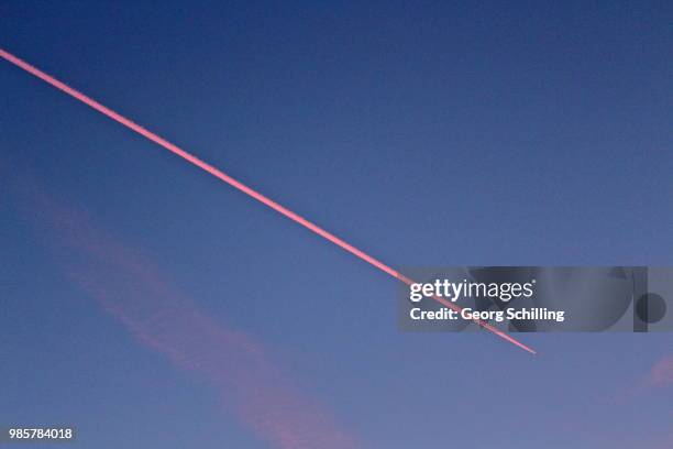 airplane - sunset with jet contrails stock pictures, royalty-free photos & images