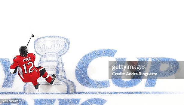 Mike Fisher of the Ottawa Senators skates over the in-ice Stanley Cup logo during warmups prior to a game against the Pittsburgh Penguins in Game...