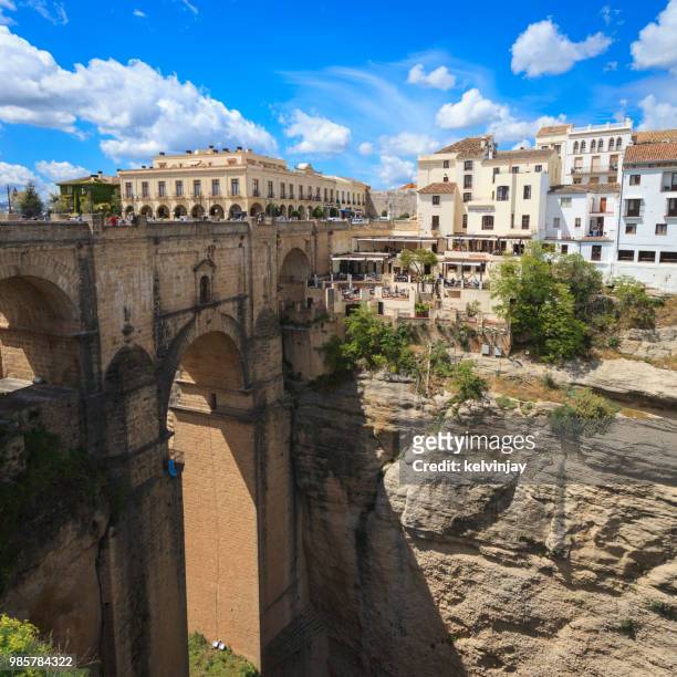 the bridge and gorge in ronda, andalusia, spain. - kelvinjay stock pictures, royalty-free photos & images