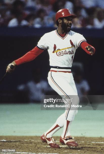 Ozzie Smith of the St. Louis Cardinals bats during a MLB game at Busch Stadium in August 1983 in St. Louis, Missouri.