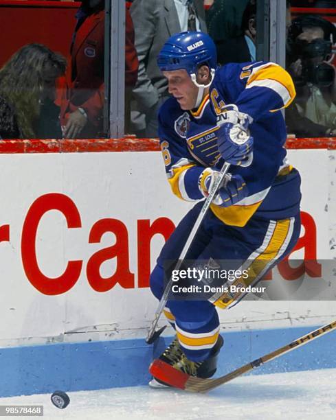Brett Hull of the St. Louis Blues skates with the puck against the Montreal Canadiens in the 1990's at the Montreal Forum in Montreal, Quebec, Canada.