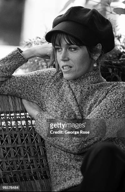 Academy Award-winning actress Jane Fonda talks with a reporter on the veranda of her home in this 1975 Santa Monica, California, photo portrait...