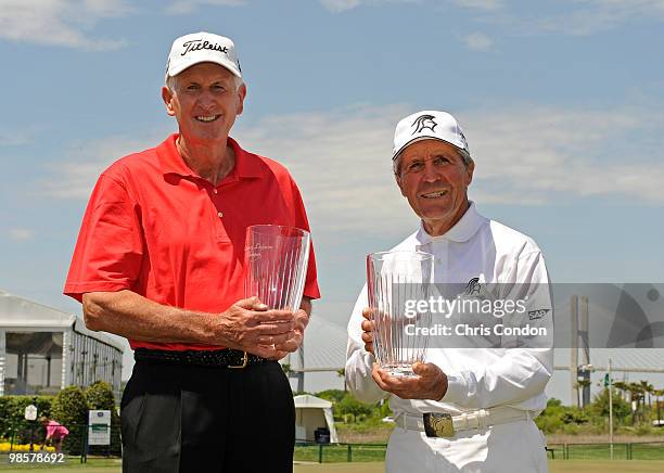 Bob Charles and Gary Player pose with trophies after winning the Demaret Division at the Liberty Mutual Legends of Golf at The Westin Savannah Harbor...