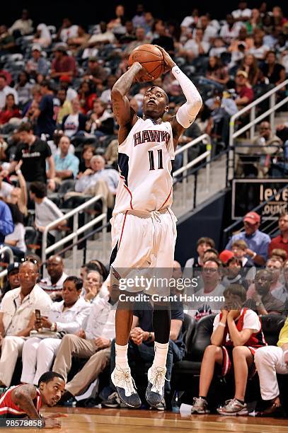 Jamal Crawford of the Atlanta Hawks shoots a jump shot against the Milwaukee Bucks in Game One of the Eastern Conference Quarterfinals during the...