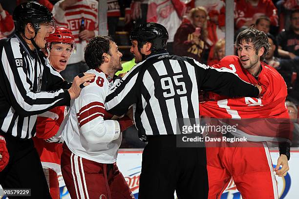 Vernon Fiddler of the Phoenix Coyotes gets mixed up with Drew Miller of the Detroit Red Wings during Game Four of the Eastern Conference...