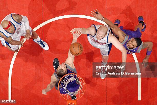 Chris Kaman of the Los Angeles Clippers puts a shot up against Louis Amundson of the Phoenix Suns at Staples Center on March 3, 2010 in Los Angeles,...