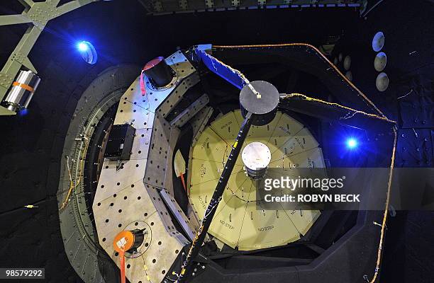 The primary telescope mirror, seen under yellow protective panels inside the open telescope bay is shown at the first public viewing of the...