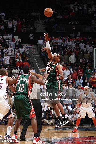 Kurt Thomas of the Milwaukee Bucks battles for the opening tip against Josh Smith of the Atlanta Hawks in Game Two of the Eastern Conference...