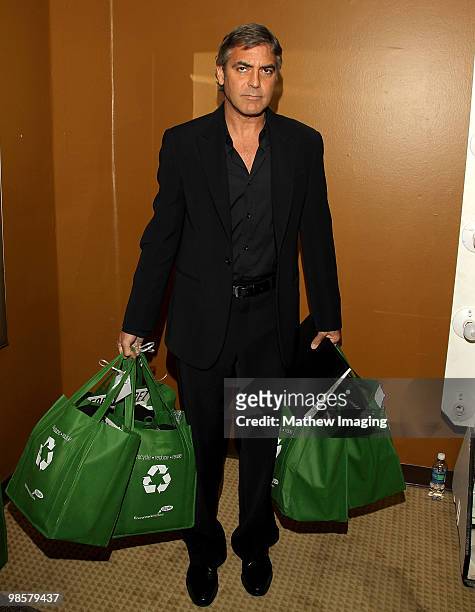 Actor George Clooney playfully spoofs Sarah Palin with some gift bags at the 47th Annual ICG Publicist Awards at the Hyatt Regency Century Plaza on...