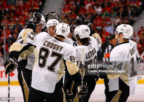 Evgeni Malkin of the Pittsburgh Penguins is congratulated by his teammates Sidney Crosby;Sergei Gonchar; Kris Letang and Chris Kunitz for his goal...