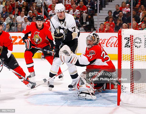 Brian Elliott of the Ottawa Senators makes a big save off a point blank shot by Evgeni Malkin of the Pittsburgh Penguins during Game 4 of the Eastern...