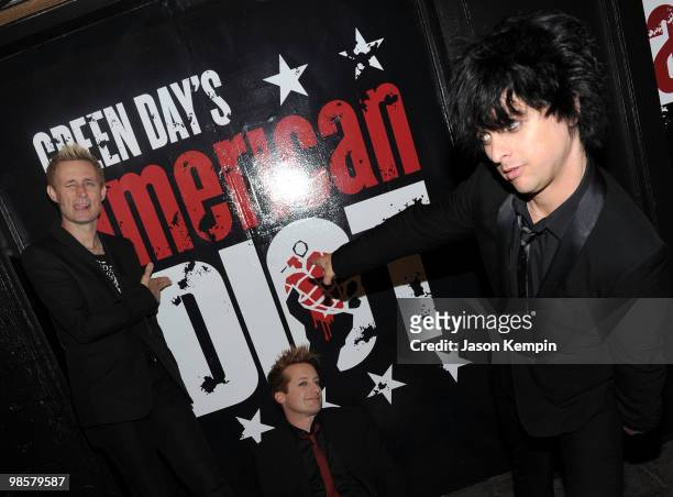 Musicians Mike Dirnt, Tre Cool and Billie Joe Armstrong of Green Day attend the Broadway Opening of "American Idiot" at the St. James Theatre on...