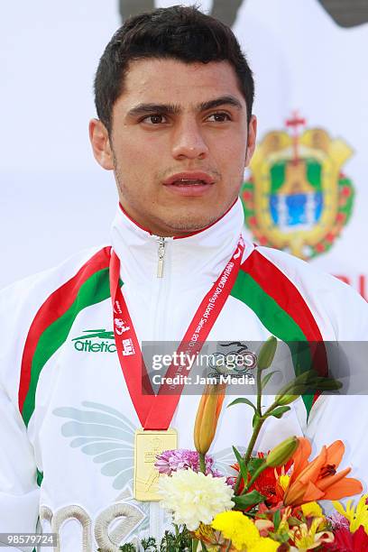 Yahel Castillo receives the gold medal of the 3 meter men's competition during the FINA Diving World Series 2010 at Leyes de Reforma pool on April...