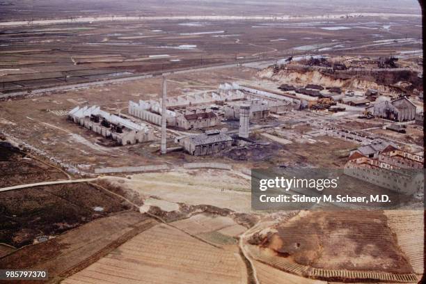 Aerial view of roofless, bombed-out factory buildings, destroyed during the ongoing Korean War, Seoul, South Korea, April 1952.