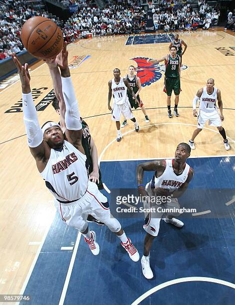Josh Smith of the Atlanta Hawks battles for a rebound against Ersan Ilyasova of the Milwaukee Bucks in Game Two of the Eastern Conference...
