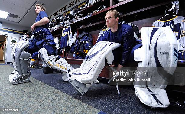 Pekka Rinne, right, of the Nashville Predators straps on his pads as Dan Ellis stretches before warm ups against the Chicago Blackhawks in Game Three...