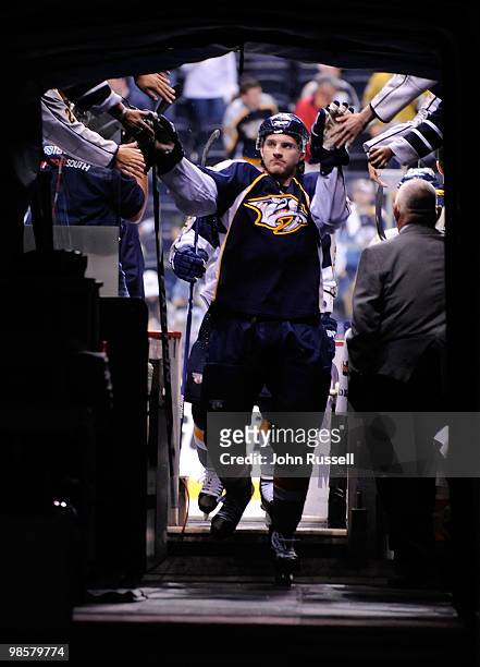 Cody Franson of the Nashville Predators high fives fans after warmups against the Chicago Blackhawks in Game Three of the Western Conference...