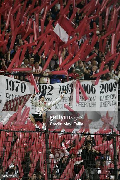 Supporters of Estudiantes cheer their team up during their Copa Libertadores soccer match against Peru's Alianza Lima at the Centenario Quilmes...