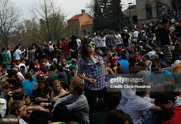 Young woman stands in the crowd during a "smoke out" with thousands of others April 20, 2010 at the University of Colorado in Boulder, Colorado....