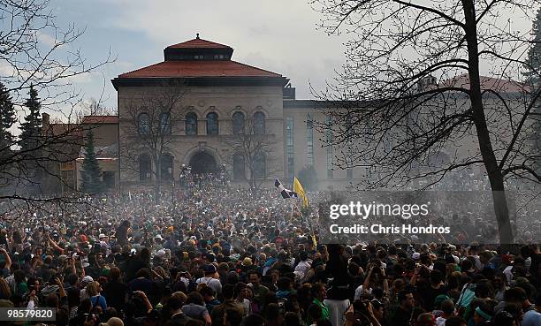 The haze of marijuana smoke looms over a crowd of thousands at 4:20 pm April 20, 2010 at the University of Colorado in Boulder, Colorado. April 20th...