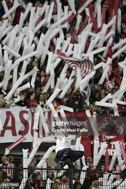 Supporters of Estudiantes cheer their team up during their Copa Libertadores soccer match against Peru's Alianza Lima at the Centenario Quilmes...