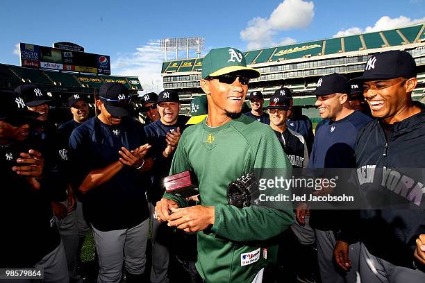 Edwar Ramirez of the Oakland Athletics celebrates with his former teammates after receiving his World Series ring from the 2009 season from the New...