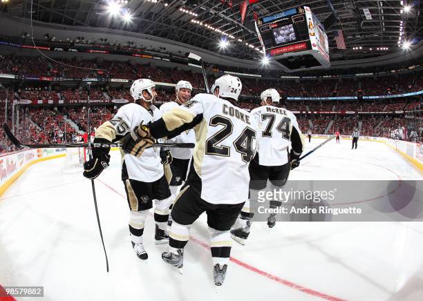 Matt Cooke of the Pittsburgh Penguins celebrates his second period goal against the Ottawa Senators with teammates Maxime Talbot, Jordan Staal and...