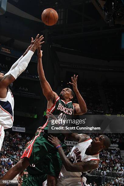 Kurt Thomas of the Milwaukee Bucks battles for a rebound against Josh Smith of the Atlanta Hawks in Game Two of the Eastern Conference Quarterfinals...