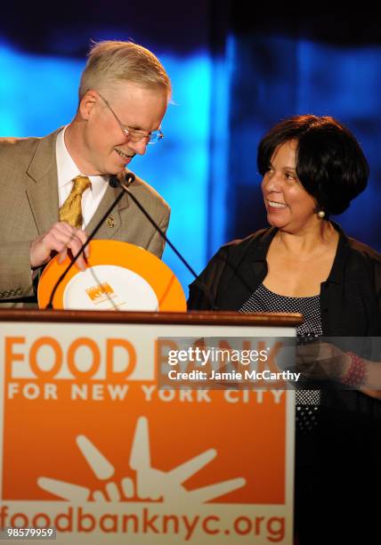 Honoree and Executive Director of St.John's Bread and Life Anthony Butler with President and CEO of Food Bank for New York City Lucy Cabrera at the...