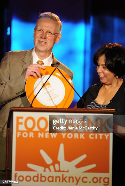 Honoree and Executive Director of St.John's Bread and Life Anthony Butler with President and CEO of Food Bank for New York City Lucy Cabrera at the...