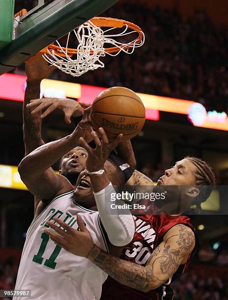 Glen Davis of the Boston Celtics fights for the ball with Udonis Haslem and Michael Beasley of the Miami Heat during Game Two of the Eastern...