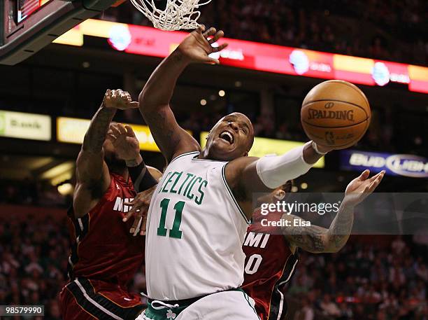 Glen Davis of the Boston Celtics fights for the ball with Udonis Haslem and Michael Beasley of the Miami Heat during Game Two of the Eastern...