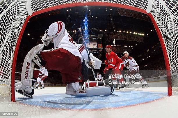 Pavel Datsyuk of the Detroit Red Wings scores as teammate Dan Cleary gets tied up by Derek Morris of the Phoenix Coyotes during Game Four of the...