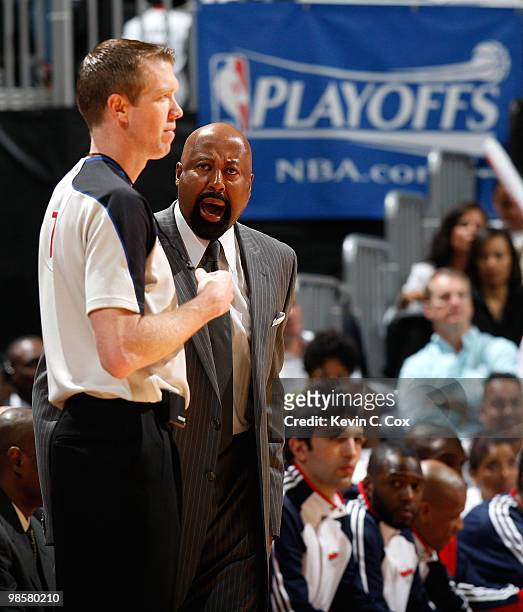 Head coach Mike Woodson of the Atlanta Hawks question referee Ed Malloy during the game against the Milwaukee Bucks at Philips Arena on April 20,...