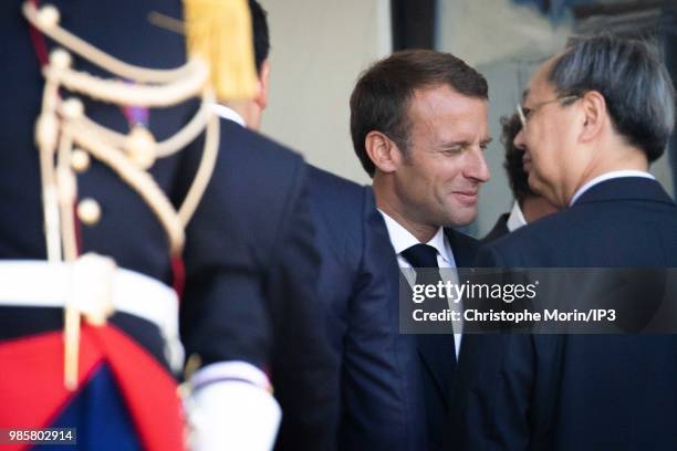French President Emmanuel Macron looks on prior to a meeting with Thailand's Prime Minister Prayuth Chan-Ocha at Elysee Palace on June 25, 2018 in...