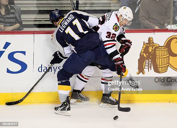 David Legwand the Nashville Predators and Kris Versteeg of the Chicago Blackhawks battle for the puck during game 3 of the Western Conference...