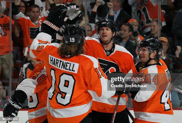 Chris Pronger, Scott Hartnell, and Kimmo Timonen of the Philadelphia Flyers celebrate agoal against the New Jersey Devils in Game Four of the Eastern...