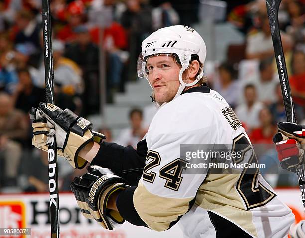 Matt Cooke of the Pittsburgh Penguins skates away after a skirmish with a smirk on his face in Game 4 of the Eastern Conference Quaterfinals against...