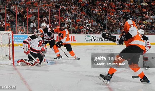 Jeff Carter of the Philadelphia Flyers misses a shot against Martin Brodeur of the New Jersey Devils in Game Four of the Eastern Conference...