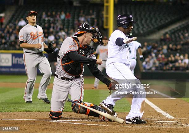 Catcher Matt Wieters of the Baltimore Orioles tags out Chone Figgins of the Seattle Mariners at Safeco Field on April 20, 2010 in Seattle, Washington.