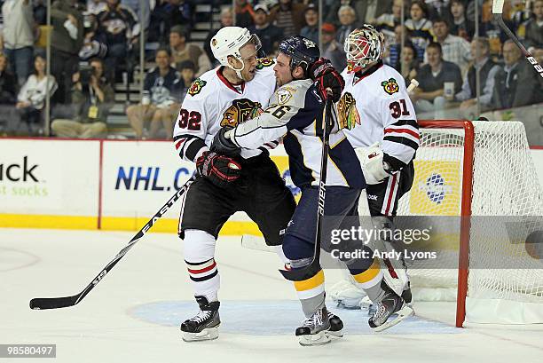 Steve Sullivan of the Nashville Predators and Kris Versteeg of the Chicago Blackhawks are tangled up during game 3 of the Western Conference...