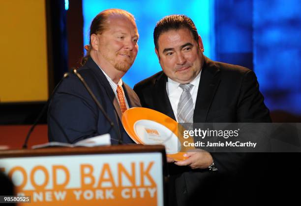 Chef Mario Batali and honoree Emeril Lagasse onstage the Food Bank for New York City's 8th Annual Can-Do Awards dinner at Abigail Kirsch�s Pier Sixty...