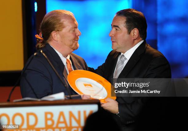 Chef Mario Batali and honoree Emeril Lagasse onstage the Food Bank for New York City's 8th Annual Can-Do Awards dinner at Abigail Kirsch�s Pier Sixty...