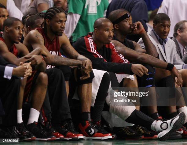 Mario Chalmers, Udonis Haslem,Quentin Richardson and Jermaine O'Neal of the Miami Heat sit on the bench in the fourth quarter against the Boston...