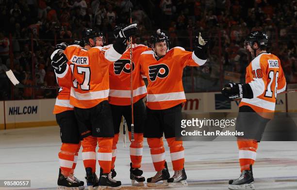 Dan Carcillo, Jeff Carter, Chris Pronger, Matt Carle, and Mike Richards of the Philadelphia Flyers celebrate Carcillo's goal in the third period...